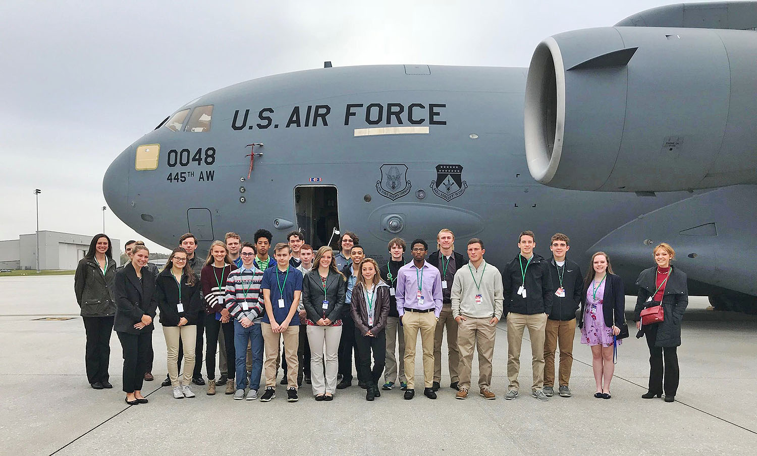 group photo with transport plane